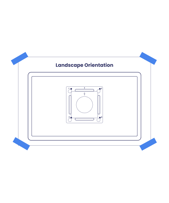 Mounting guide paper taped to a wall in landscape orientation